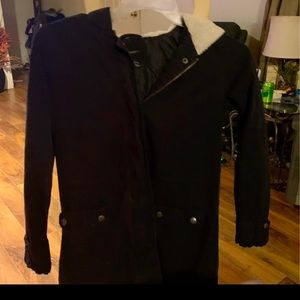 Black jacket with white fur hood